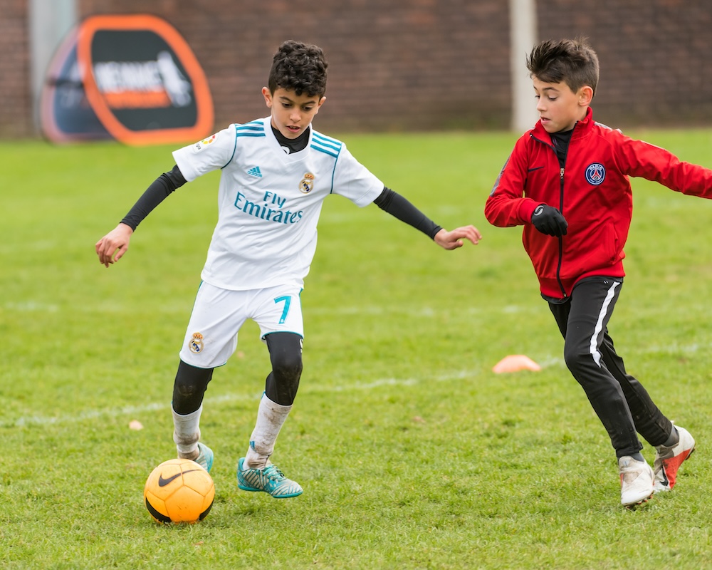 A WMF coach helping a young player at Northwood